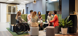 People at work gathering around a table