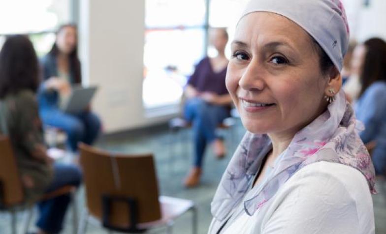 Woman with headscarf looking at camera