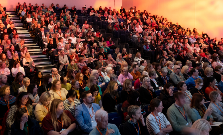 An auditorium full of people