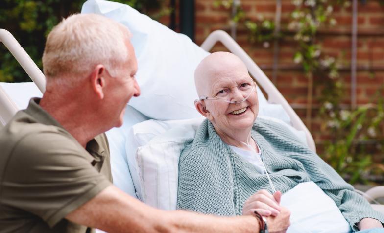 A patient and family member smiling 