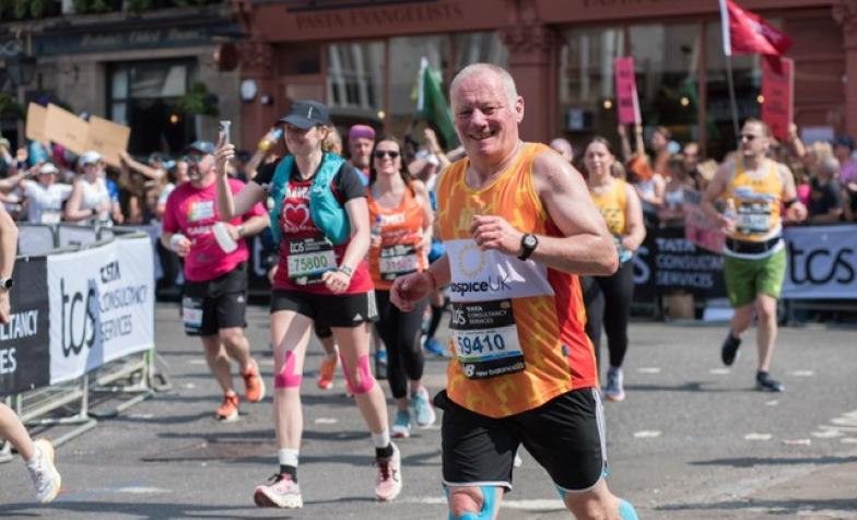 Runner in Hospice UK vest