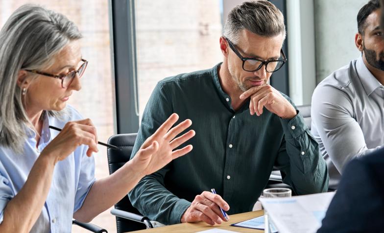 Three people in a work meeting