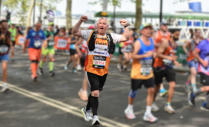 Hospice UK runner celebrating during a race