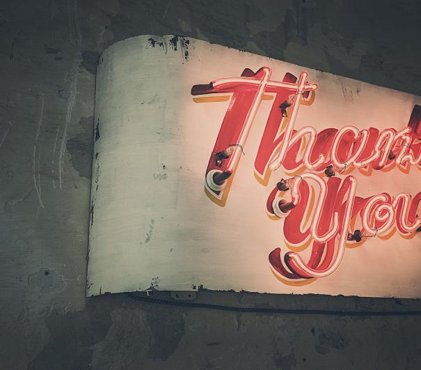 A stock photo of a neon thank you sign