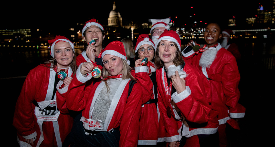Santa in the city runners dressed up