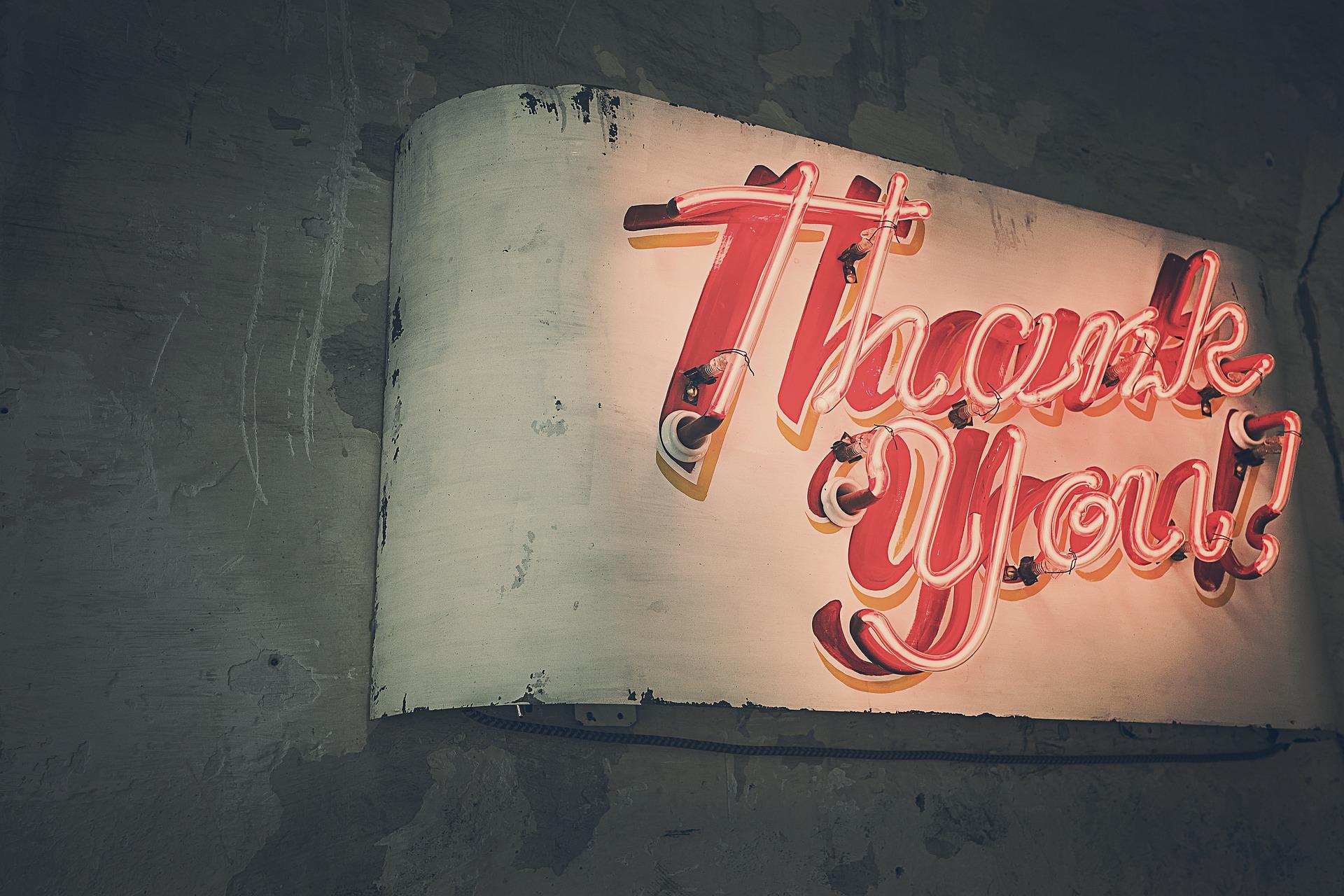 A stock photo of a neon thank you sign