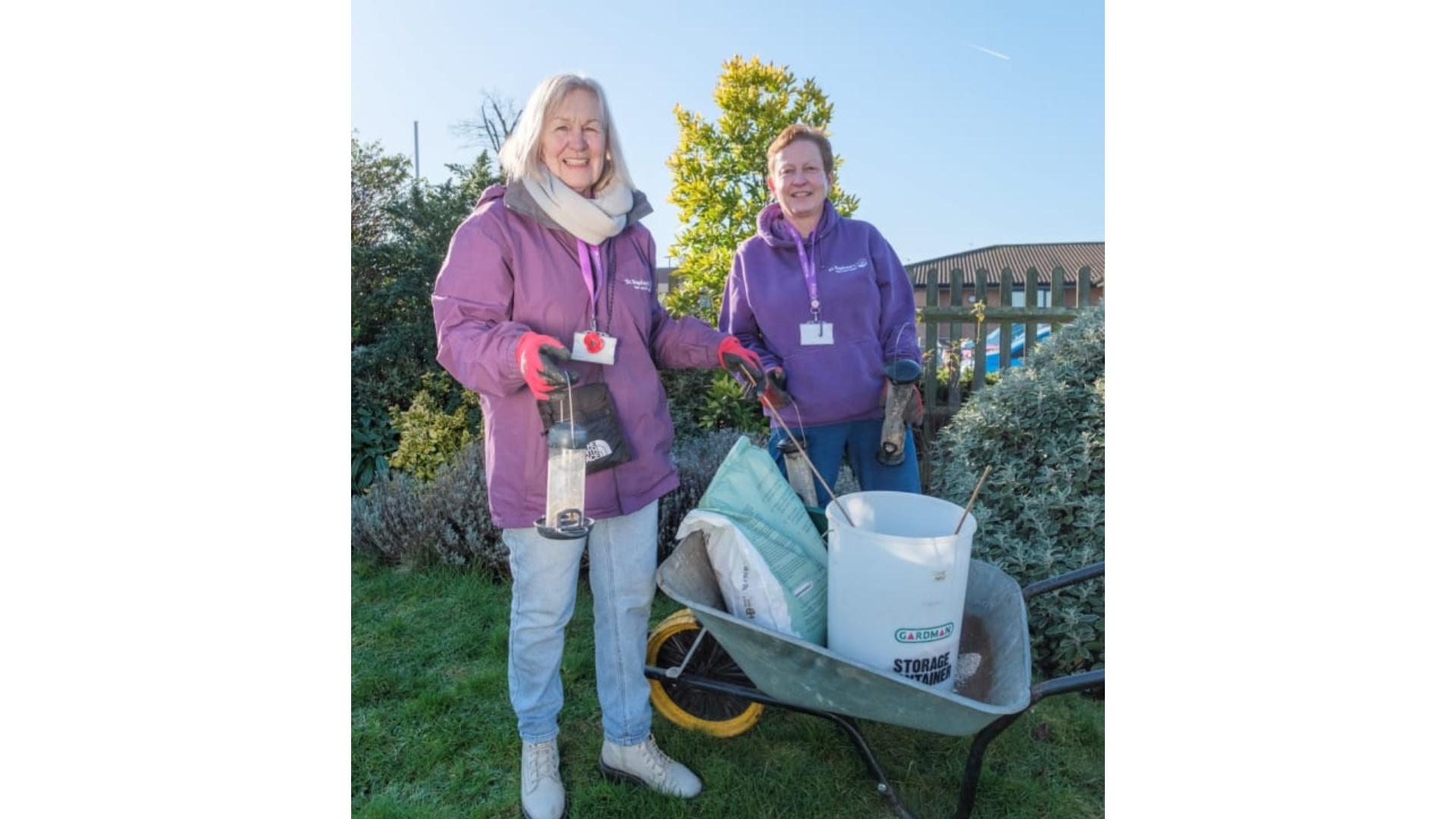 Penny Hall in the gardens at St Raphael's Hospice with fellow volunteer gardener Wendy