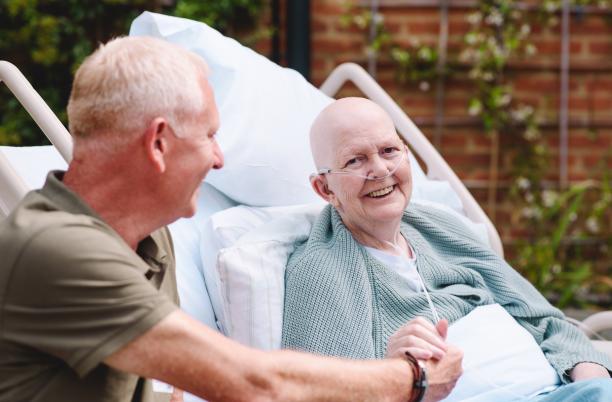 A patient and family member smiling 