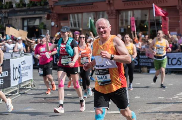 Runner in Hospice UK vest