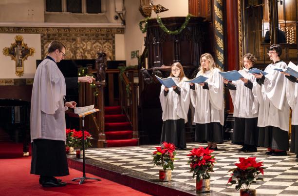 Choir singing from a stage in St Paul's Church