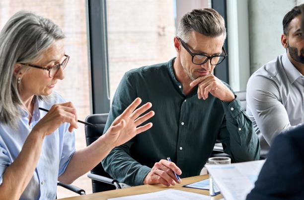 Three people in a work meeting