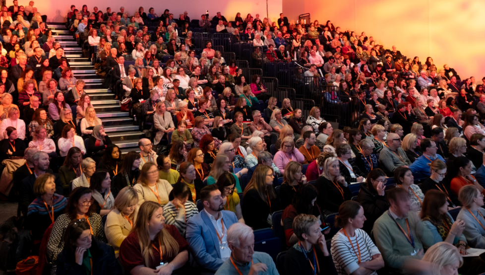 A full auditorium of people at National Conference