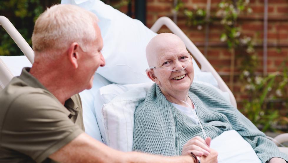 A patient and family member smiling 