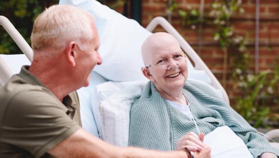 A patient and family member smiling 