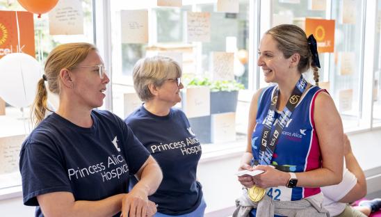 Princess Alice Hospice volunteers with a London Marathon runner