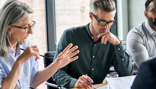Three people in a work meeting