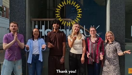 Six Hospice UK colleagues smiling and saying Thank You